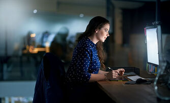 A woman is working on a computer A woman is working on a computer