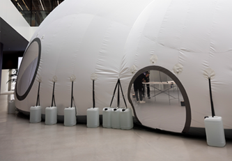 Ensuring Waldo doesn't lift off. Water jugs keep him anchored.